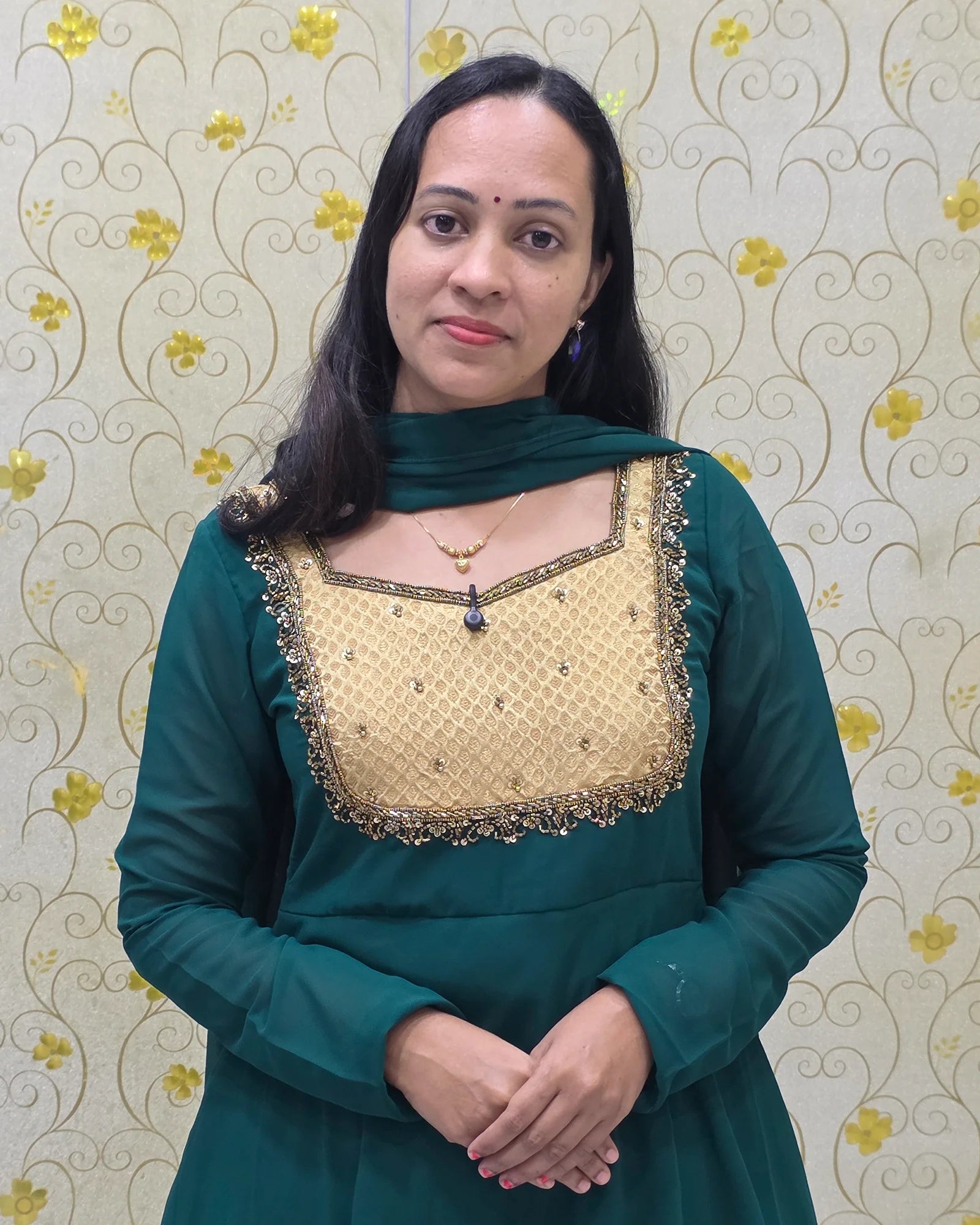 Close-up of premium hand-worked gold embroidery on Emerald Green Georgette Anarkali yoke DD1204