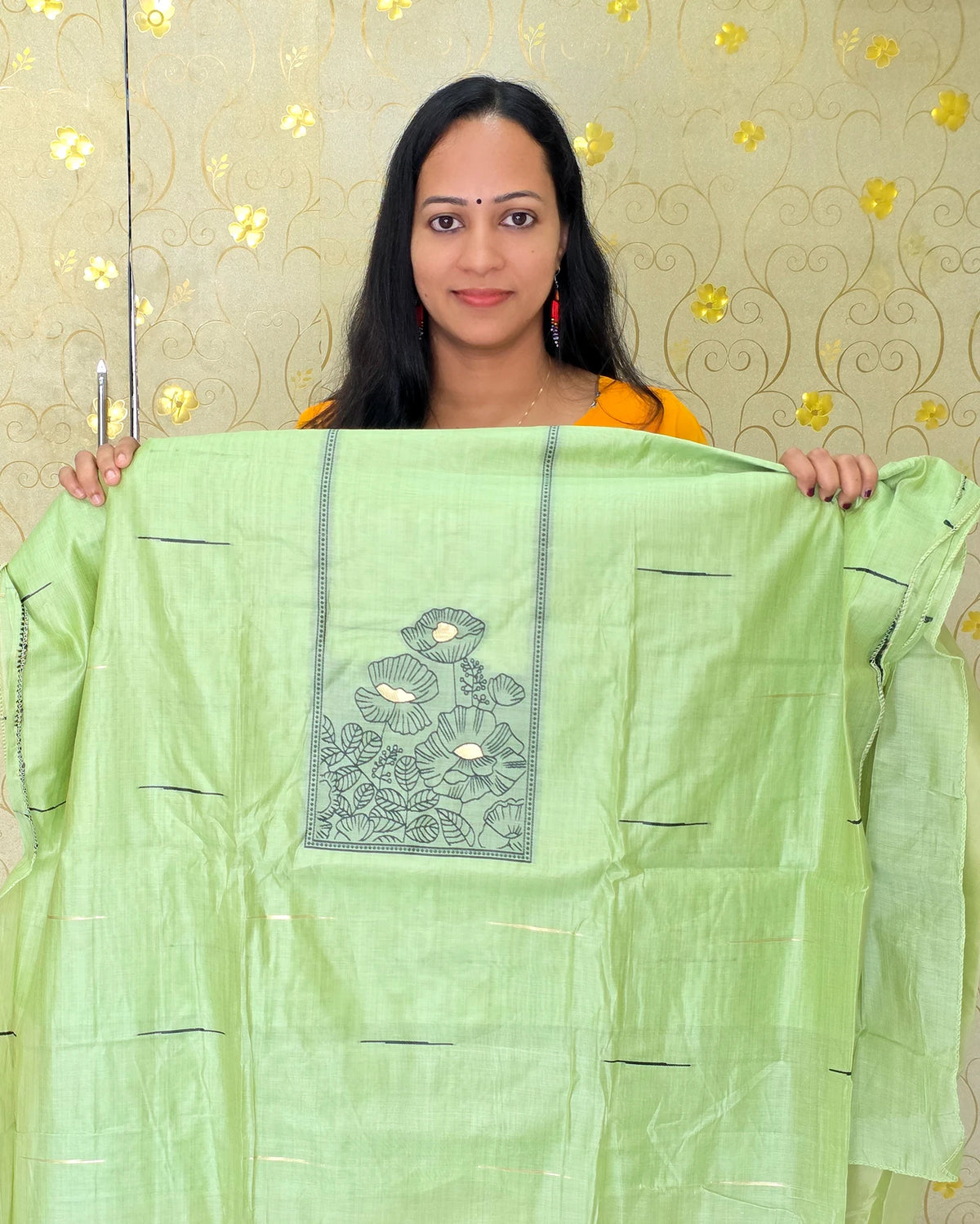 A close-up view of the light green Jamdani floral salwar material featuring elegant floral detailing by Dritha Designs, DD1209.