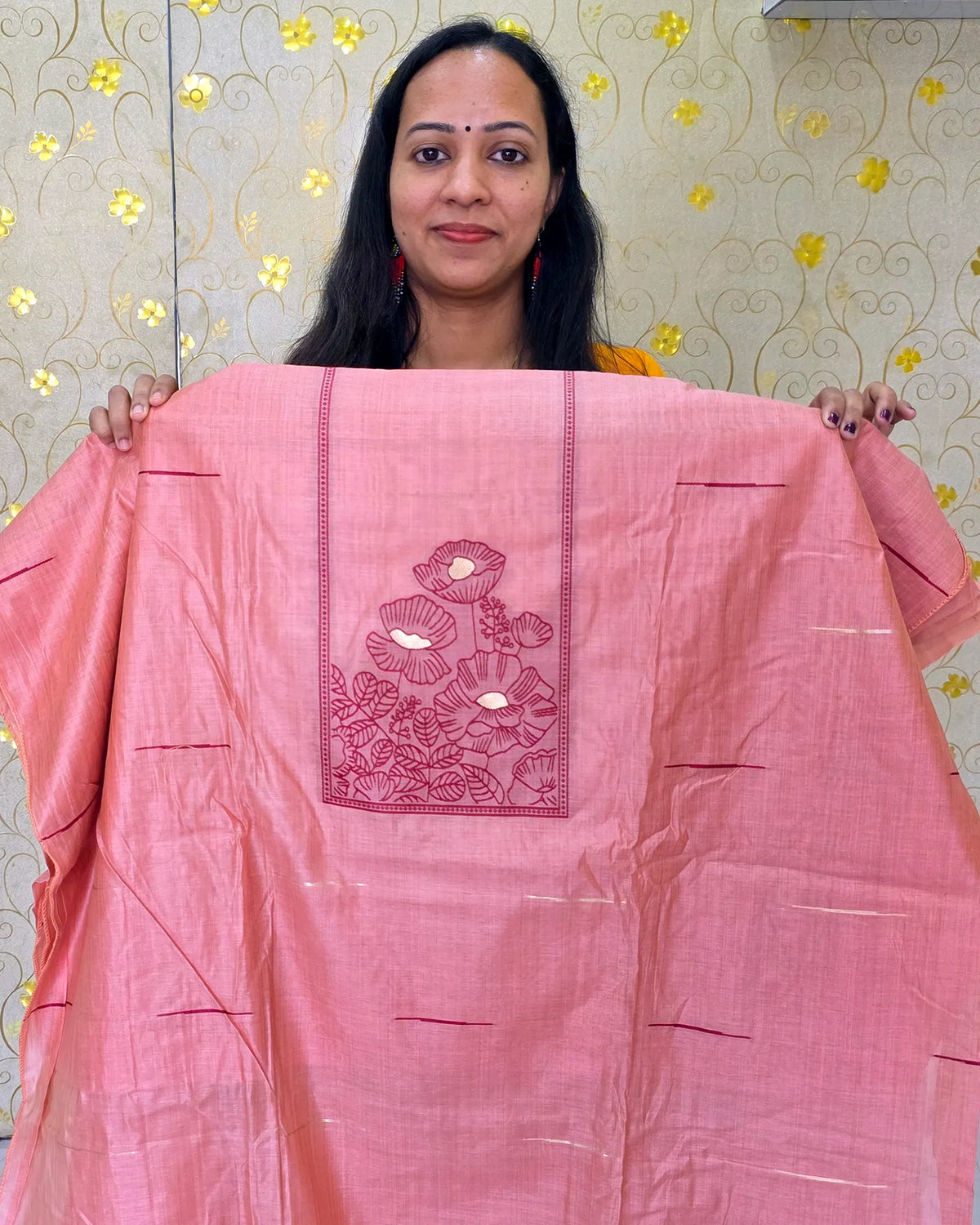 A close-up view of the peach Jamdani floral salwar material featuring delicate floral detailing by Dritha Designs, DD1209.
