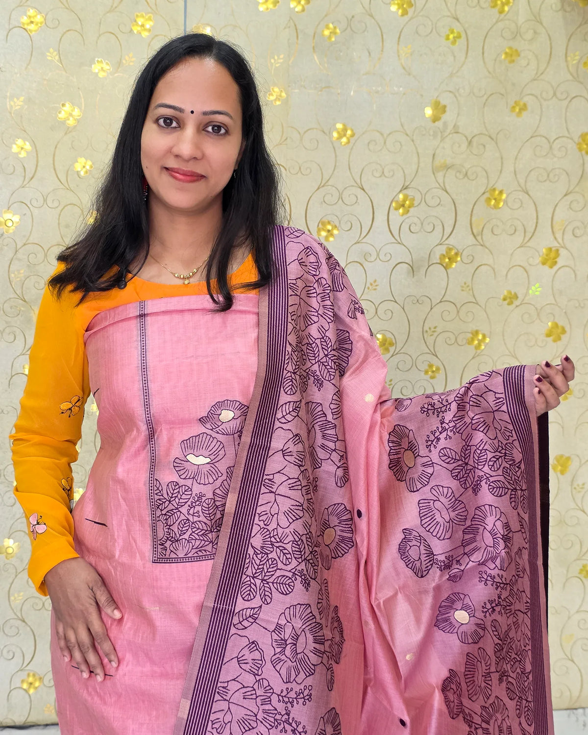 A close-up view of the pink Jamdani floral salwar material featuring delicate floral detailing by Dritha Designs, DD1209.